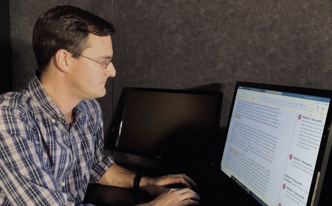 Matthew editing at computer